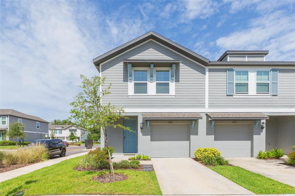 2760 Emory Sound Place Brandon, FL 33510 - Photo 2 of 52 a front view of a house with a yard and garage