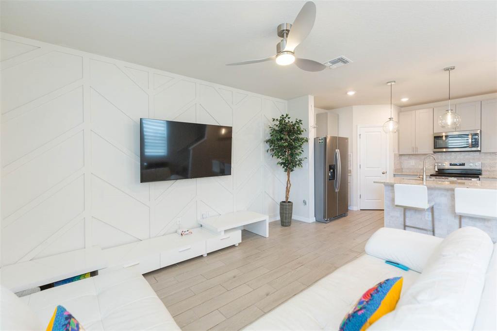 2760 Emory Sound Place Brandon, FL 33510 - Photo 21 of 52 a living room with furniture and a flat screen tv