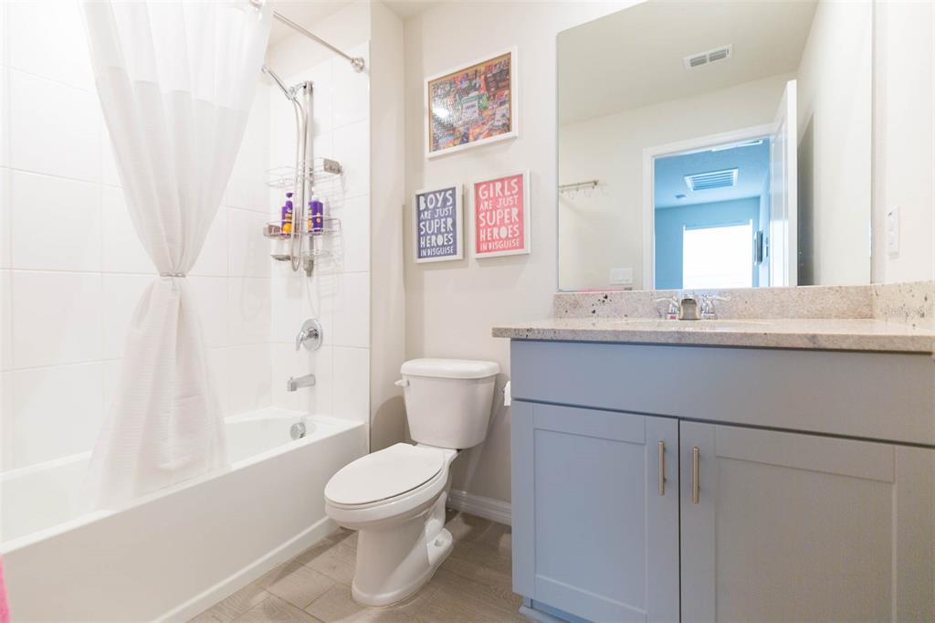 2760 Emory Sound Place Brandon, FL 33510 - Photo 32 of 52 a bathroom with a sink a toilet and shower