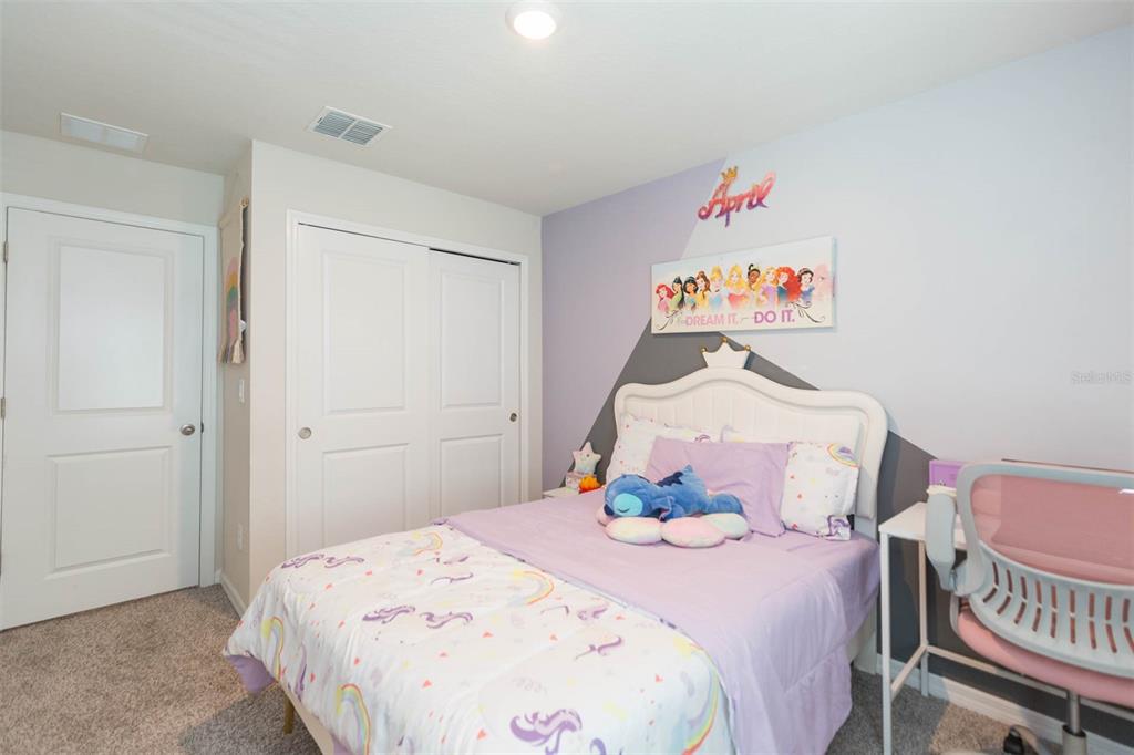 2760 Emory Sound Place Brandon, FL 33510 - Photo 37 of 52 a bedroom with a bed and a window