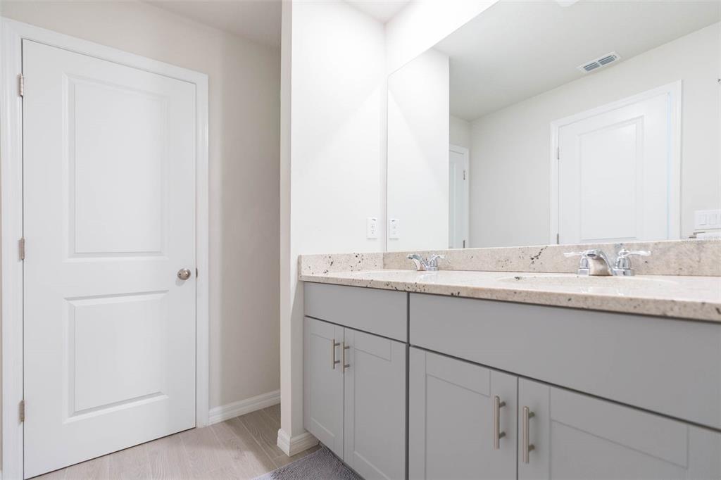 2760 Emory Sound Place Brandon, FL 33510 - Photo 48 of 52 a bathroom with a sink and a mirror