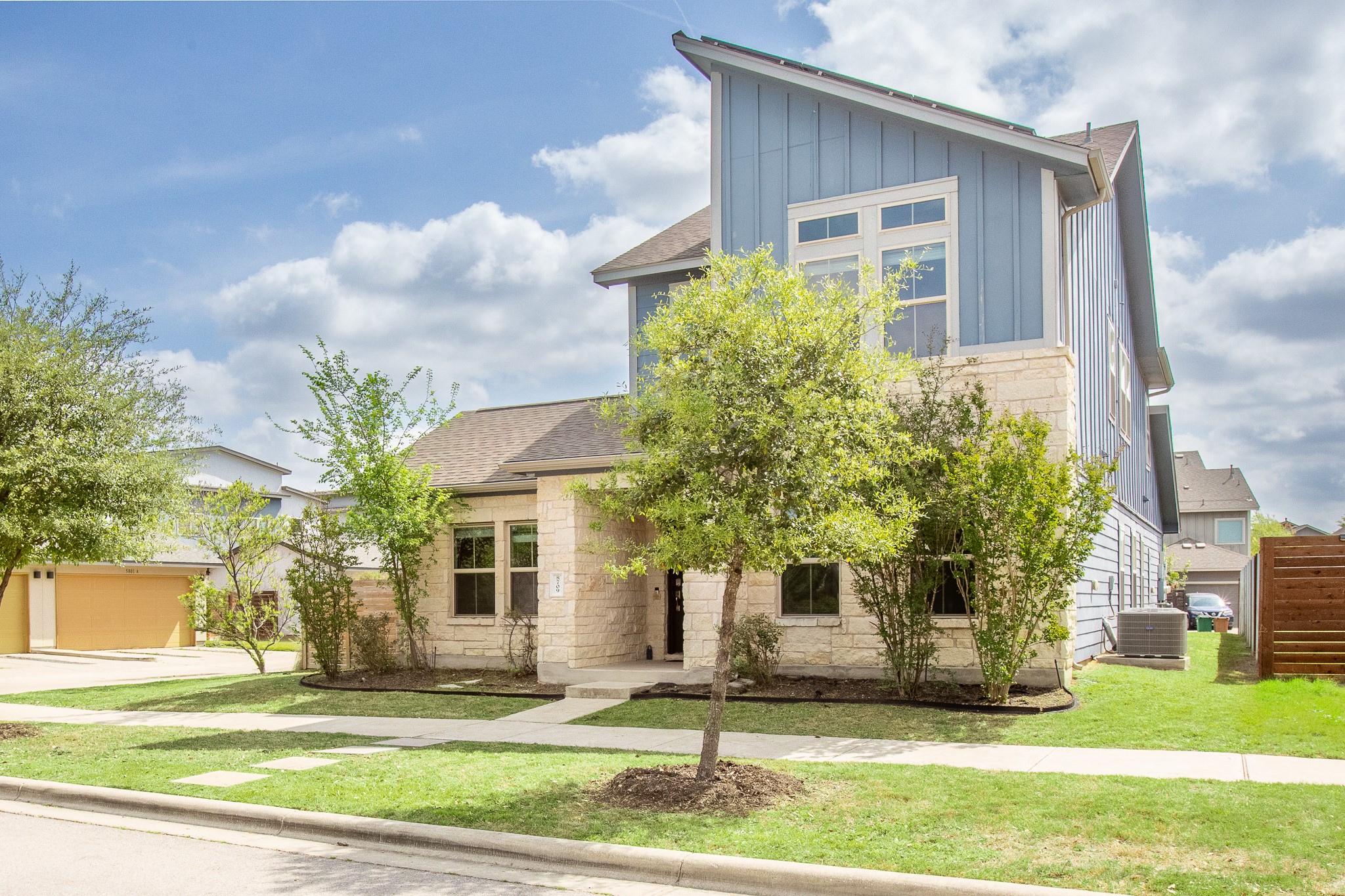 8709 Slater Drive Austin, TX 78747 - Photo 3 of 36 a front view of a house with garden
