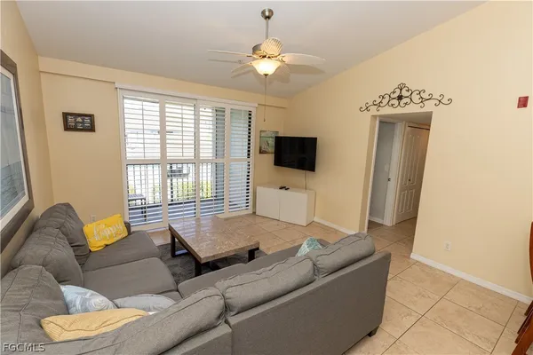 a living room with furniture and a window