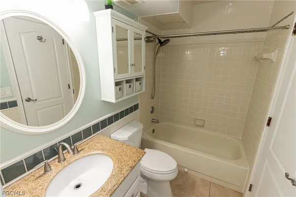 a view of a hallway with entryway and stairs