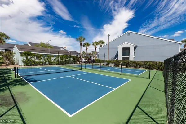 a view of a patio with table and chairs and potted plants