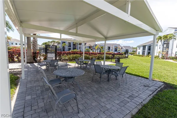 a view of a house with swimming pool and a patio