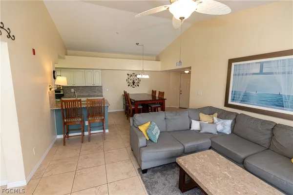 a large kitchen with a table and chairs