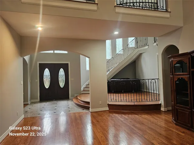 a view of front door with wooden floor