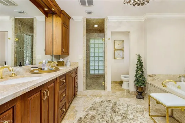 a bathroom with a sink double vanity and a shower
