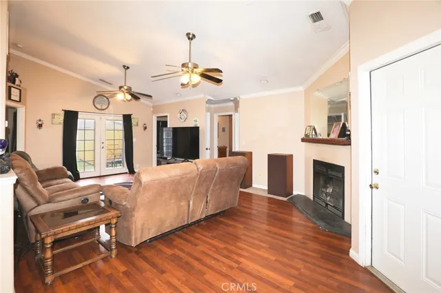 a living room with furniture fireplace and flat screen tv