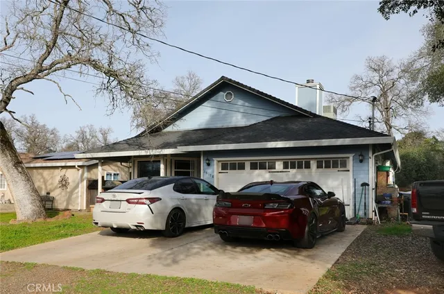 a front view of a house with parking space