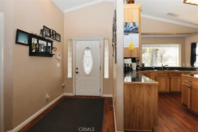 a kitchen with a refrigerator and a sink
