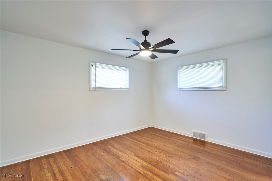 4037 Suffolk Road Cleveland, OH 44121 - Photo 16 of 26 Empty room featuring ceiling fan and hardwood / wood-style floors