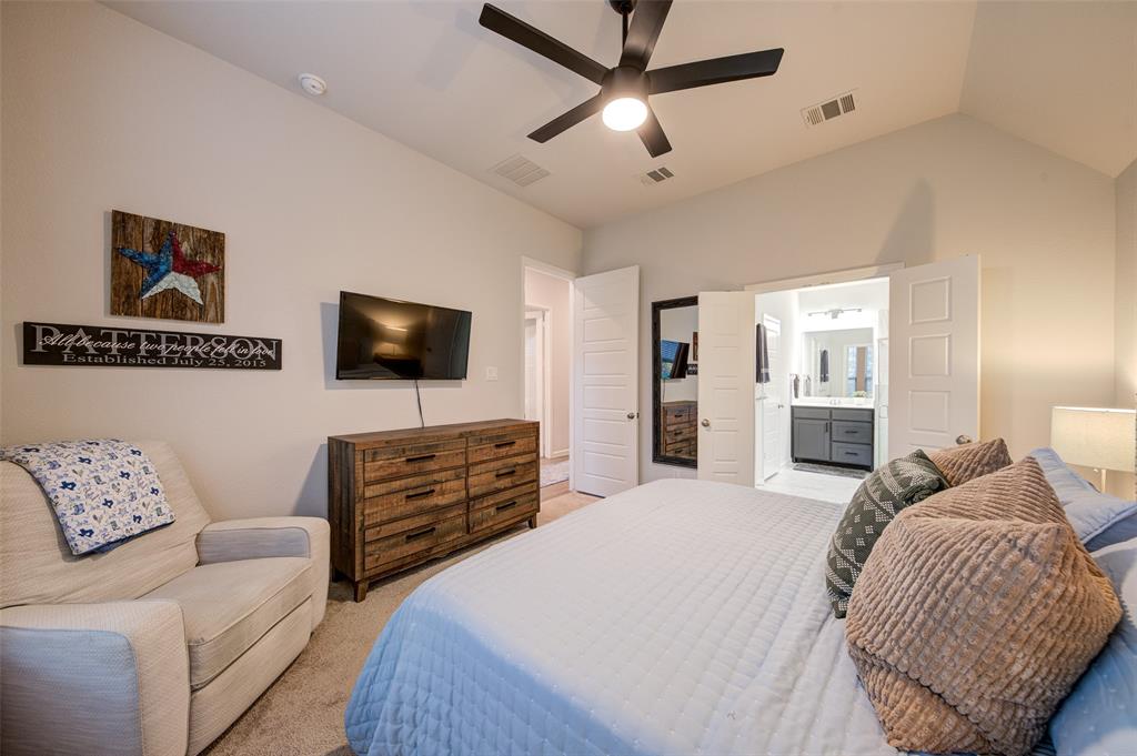 162 Palo Duro Bend Rhome, TX 76078 - Photo 13 of 25 Large primary bedroom with ensuite