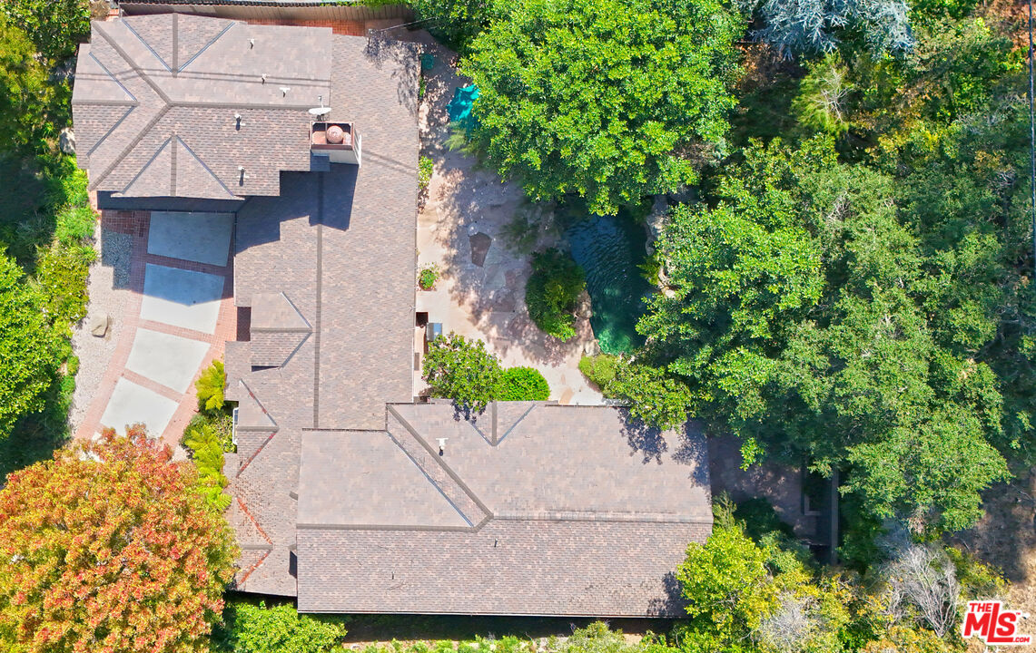 601 Tuallitan Road Los Angeles, CA 90049 - Photo 3 of 23 an aerial view of a house with a yard