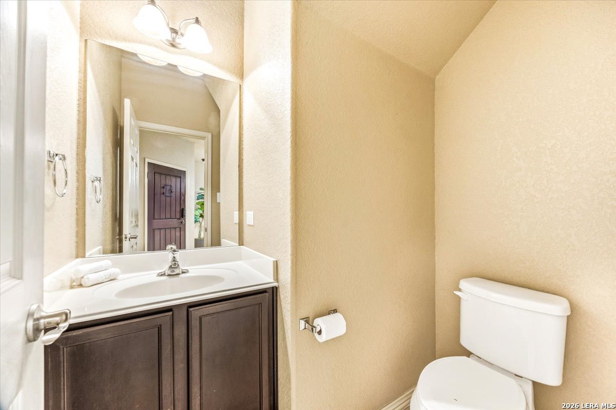 3831 Bacall Way Converse, TX 78109 - Photo 27 of 33 a bathroom with a sink and a mirror