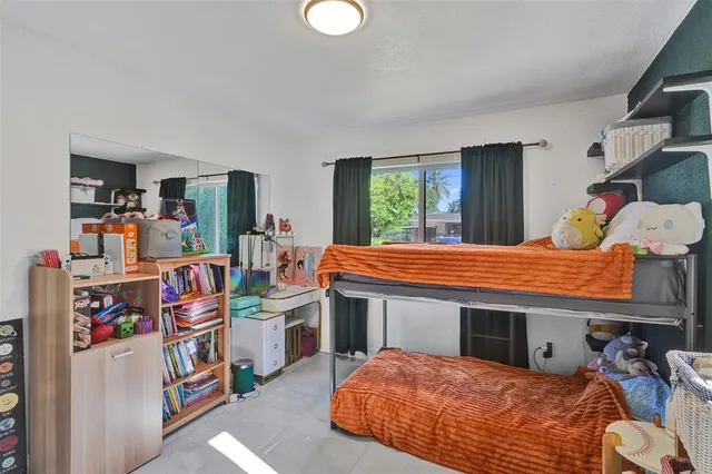 a room with a bed and a table in it