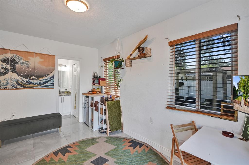 220 Northeast 165th Street Miami, FL 33162 - Photo 17 of 26 a view of livingroom with furniture and workspace