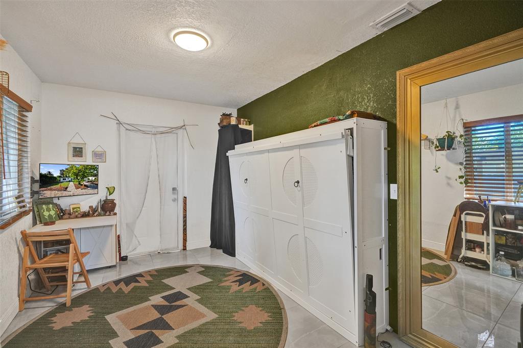 220 Northeast 165th Street Miami, FL 33162 - Photo 18 of 26 a view of kitchen with furniture and refrigerator