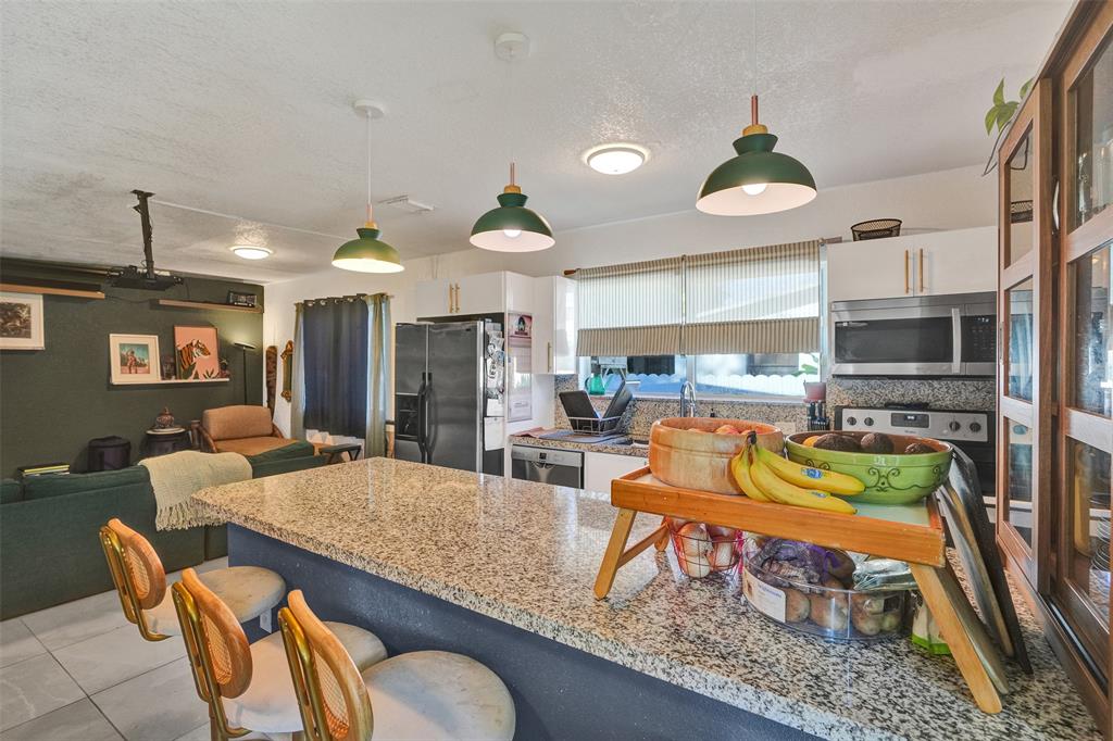 220 Northeast 165th Street Miami, FL 33162 - Photo 7 of 26 a view of a dining room with furniture