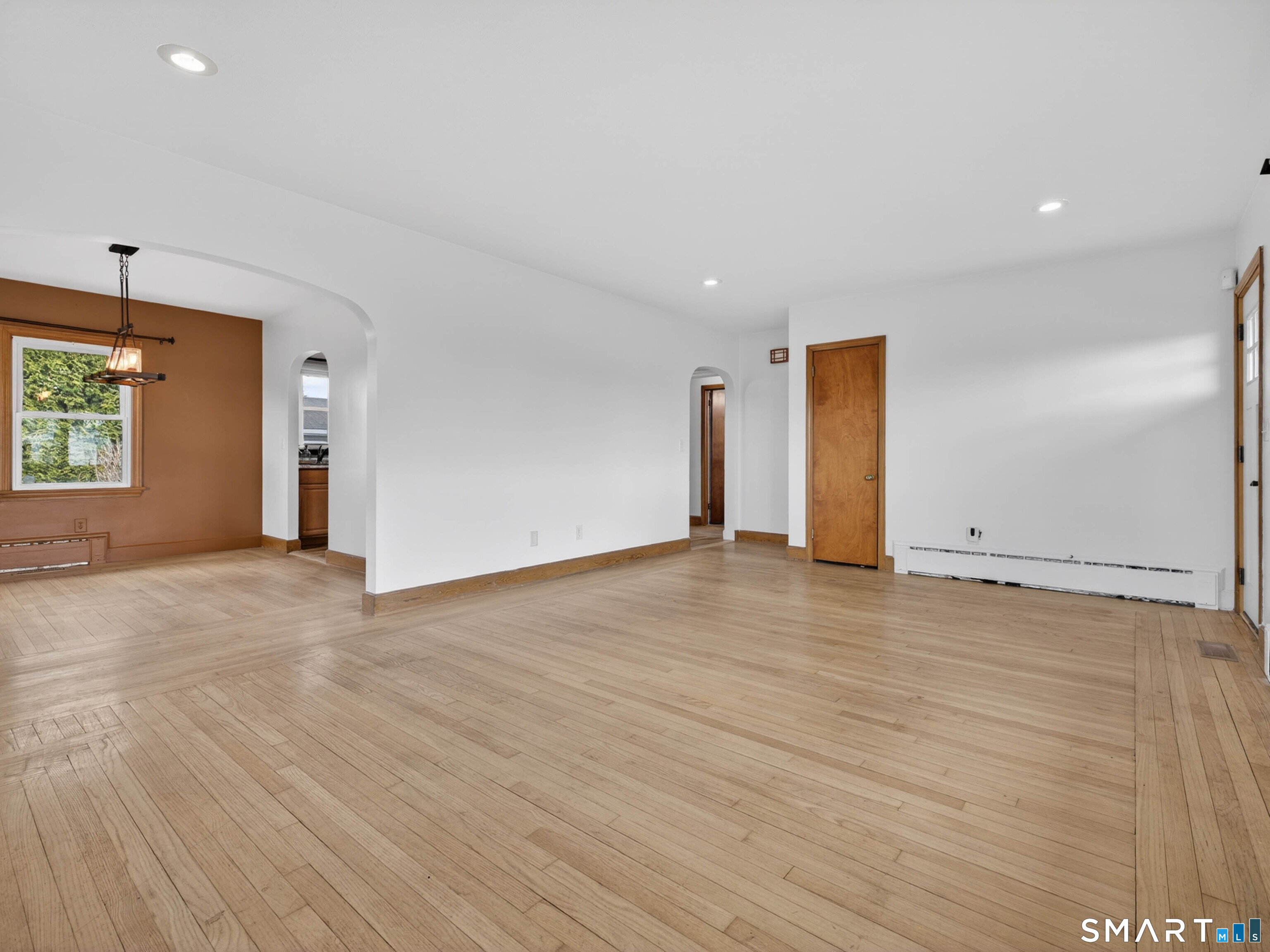 36 Baker Avenue Groton, CT 06340 - Photo 13 of 38 an empty room with wooden floor and windows
