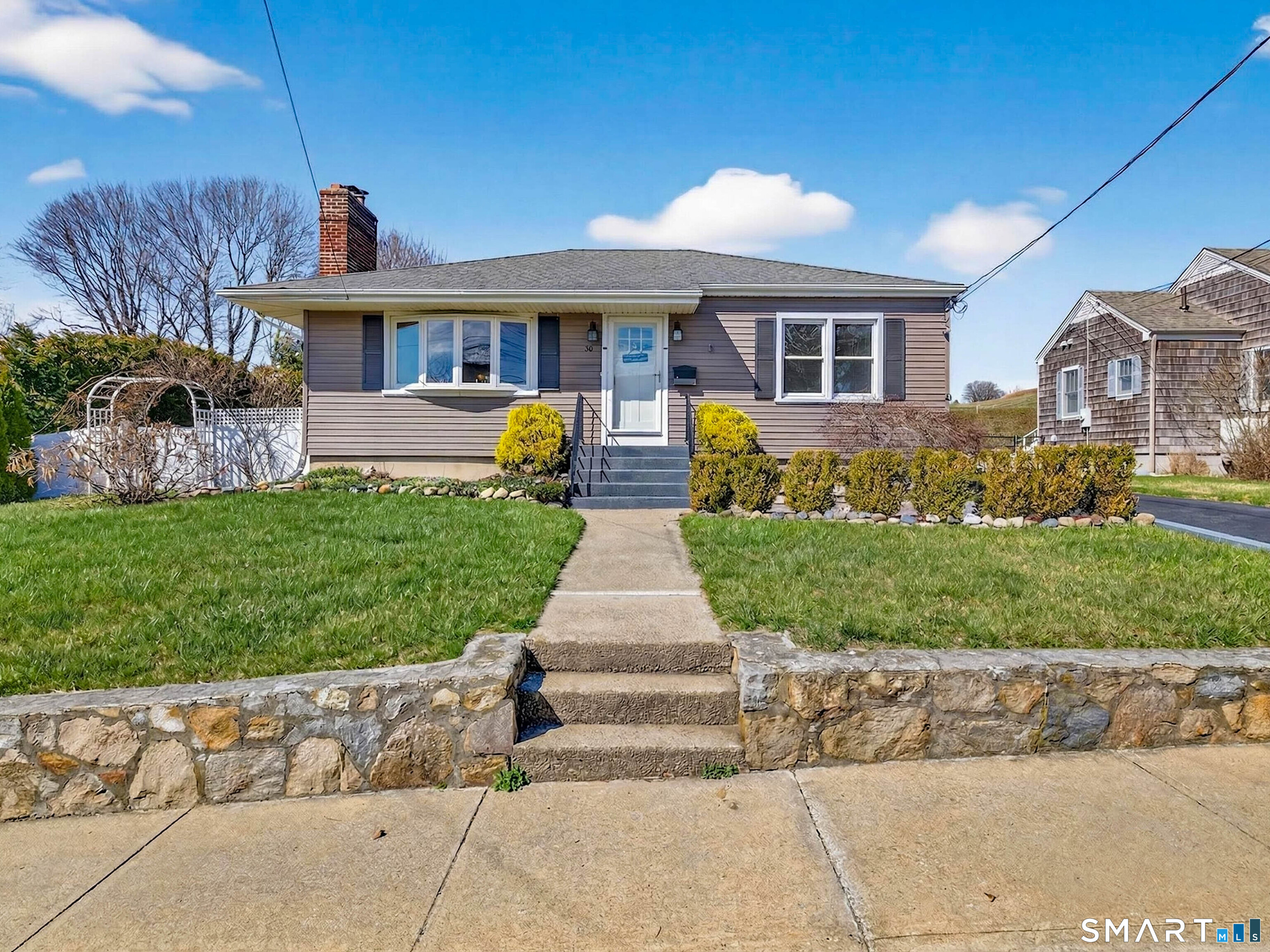36 Baker Avenue Groton, CT 06340 - Photo 15 of 38 a front view of a house with a garden
