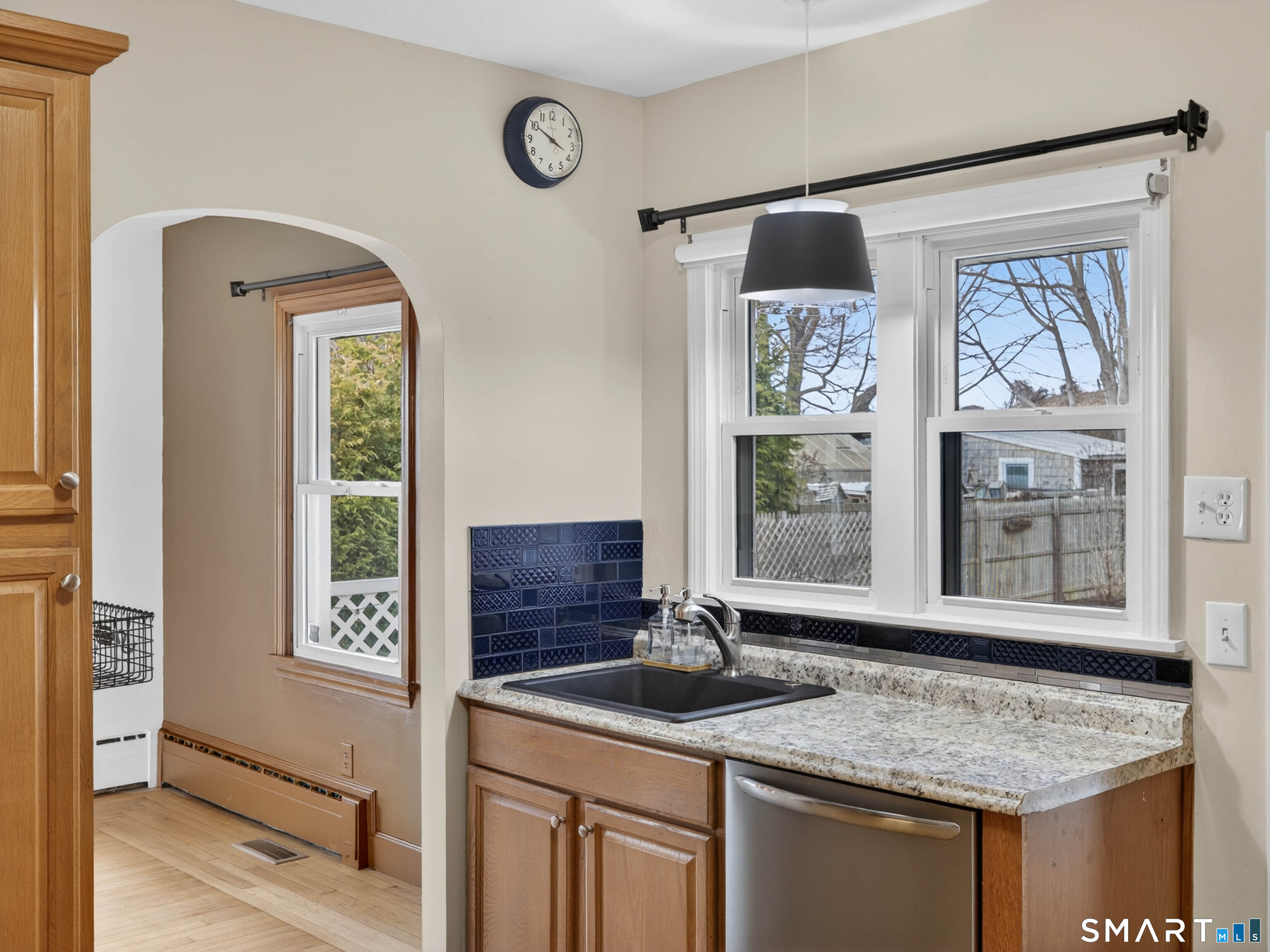 36 Baker Avenue Groton, CT 06340 - Photo 18 of 38 a bathroom with a granite countertop sink and a window