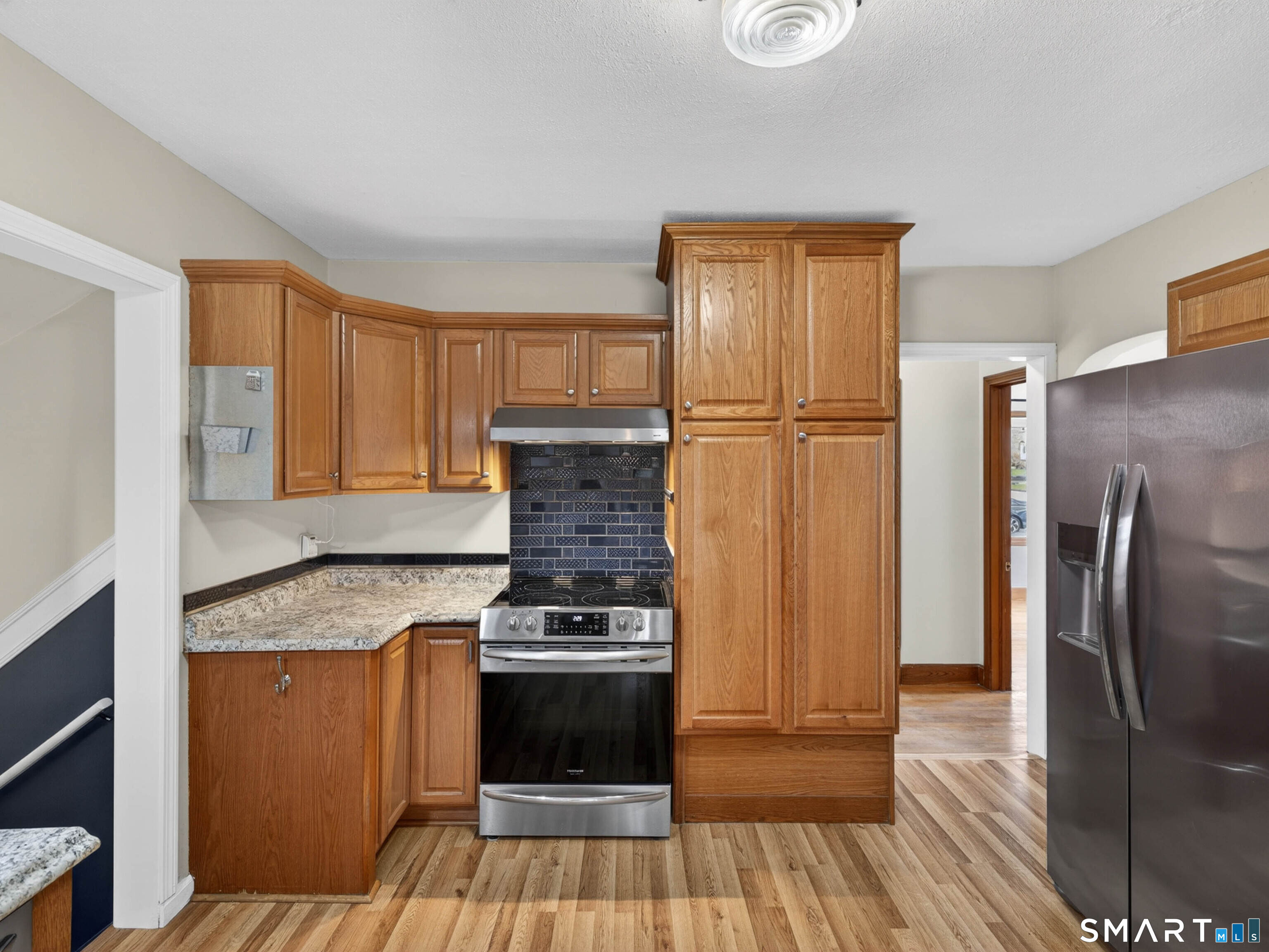 36 Baker Avenue Groton, CT 06340 - Photo 20 of 38 a kitchen with stainless steel appliances granite countertop a refrigerator stove and sink