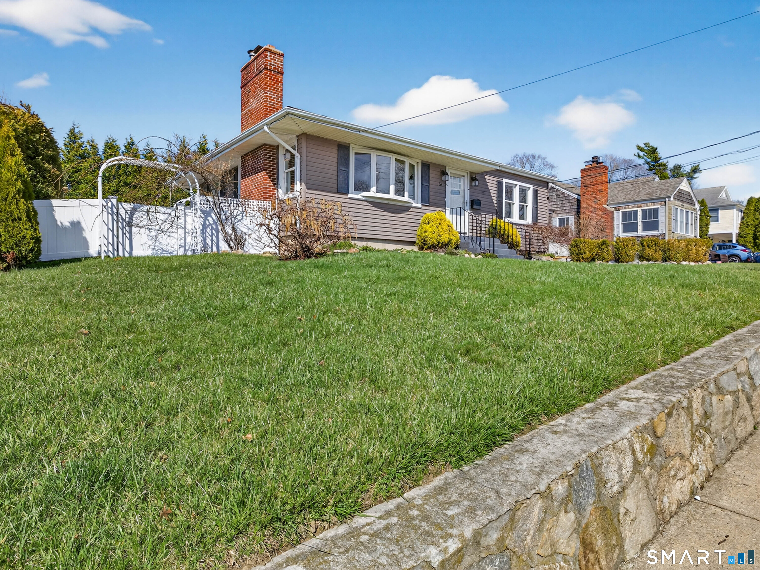 36 Baker Avenue Groton, CT 06340 - Photo 27 of 38 a front view of a house with garden