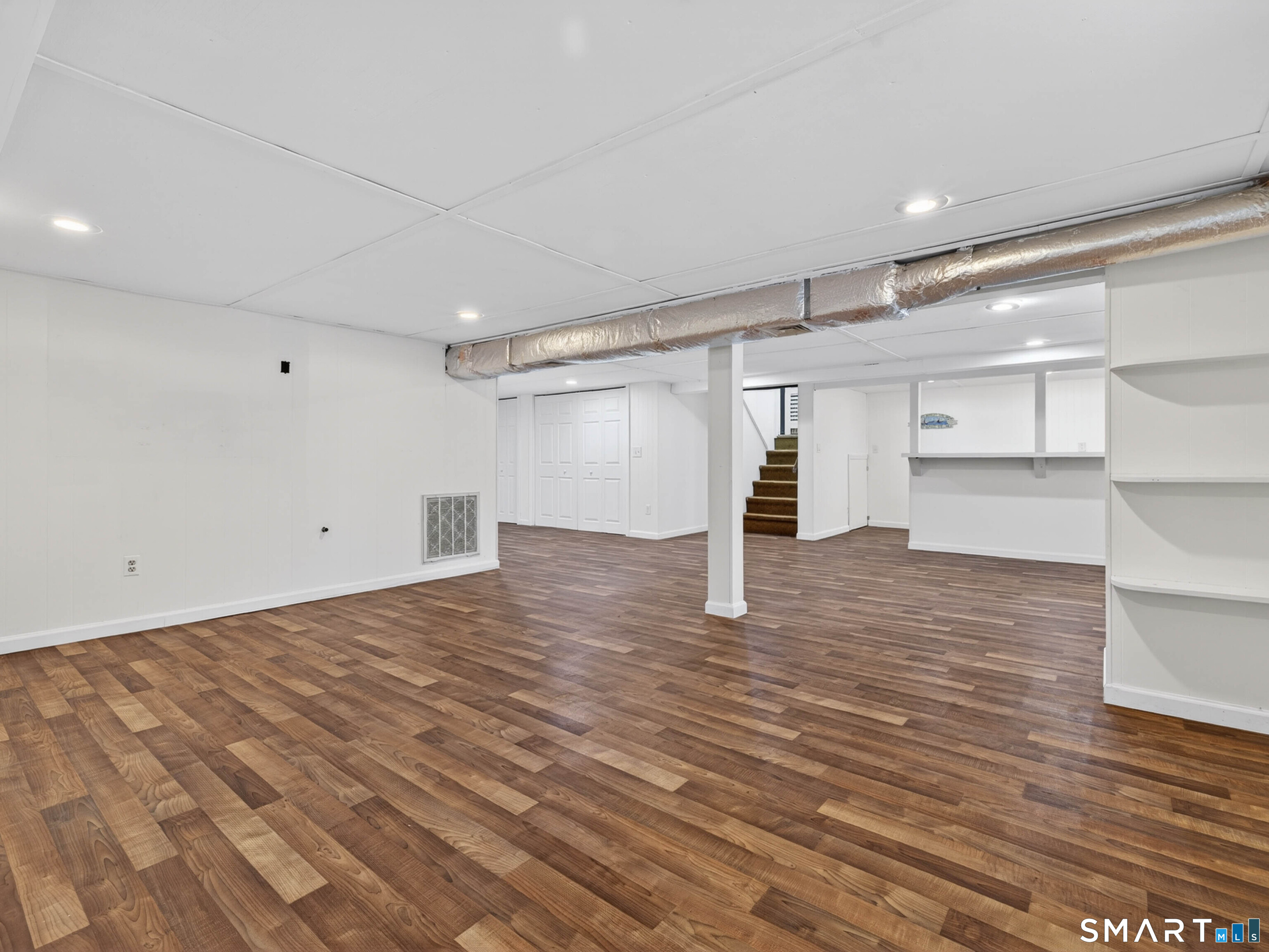 36 Baker Avenue Groton, CT 06340 - Photo 31 of 38 a view of empty room with wooden floor