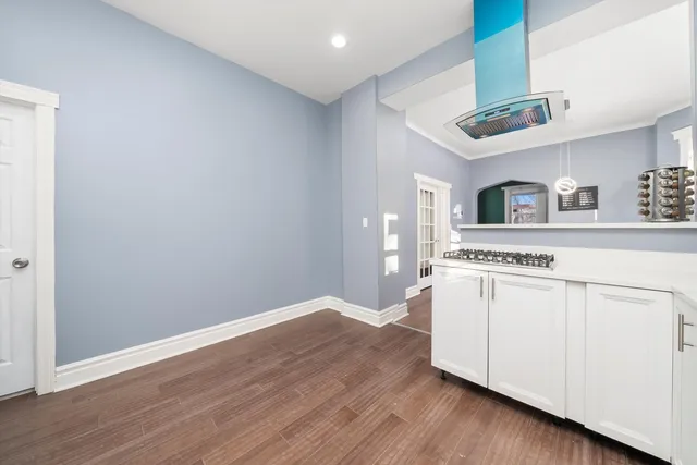a view of a kitchen with a sink and a microwave