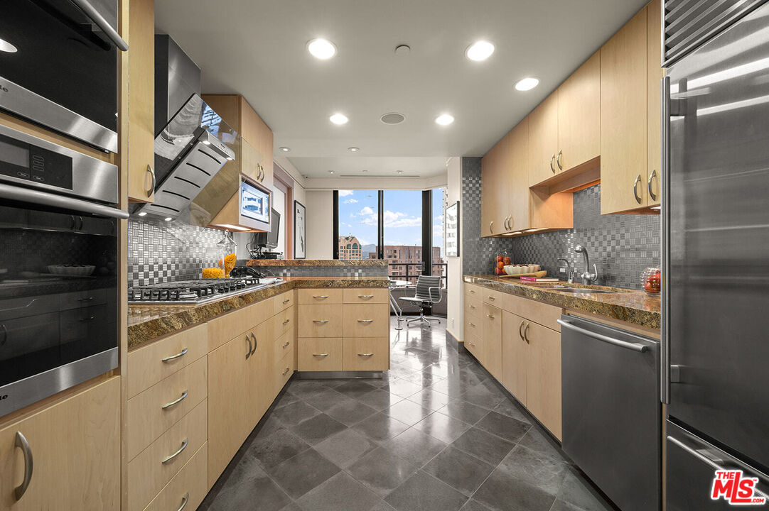 10601 Wilshire Boulevard, Unit 1201 Los Angeles, CA 90024 - Photo 13 of 48 a kitchen with sink and cabinets