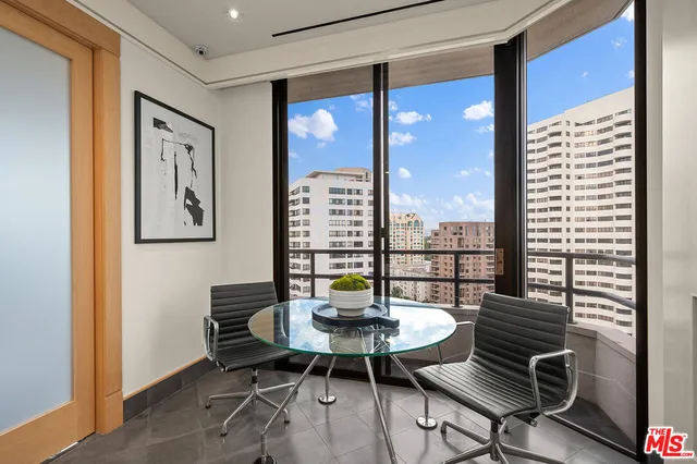 a view of a dining room with furniture wooden floor and a window