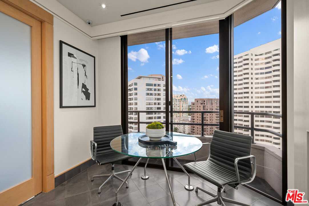 10601 Wilshire Boulevard, Unit 1201 Los Angeles, CA 90024 - Photo 14 of 48 a view of a dining room with furniture wooden floor and a window