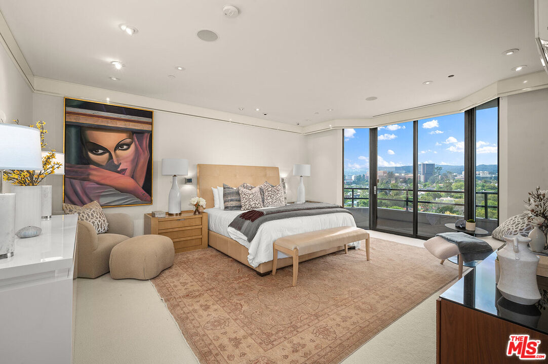 10601 Wilshire Boulevard, Unit 1201 Los Angeles, CA 90024 - Photo 16 of 48 a bed room with a bed and a large window