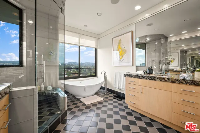 a bathroom with a sink a toilet and bathtub