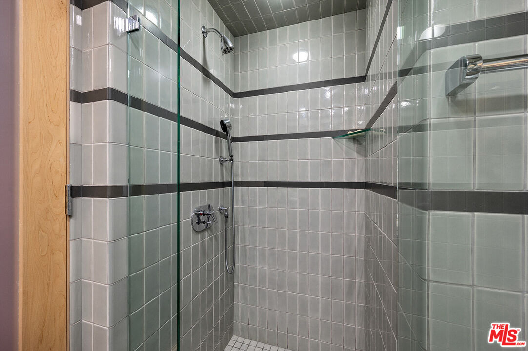 10601 Wilshire Boulevard, Unit 1201 Los Angeles, CA 90024 - Photo 32 of 48 a bathroom with a shower