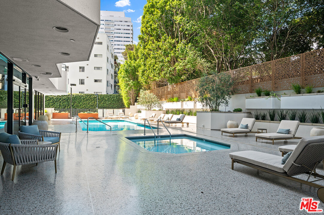 10601 Wilshire Boulevard, Unit 1201 Los Angeles, CA 90024 - Photo 35 of 48 a view of a patio with swimming pool