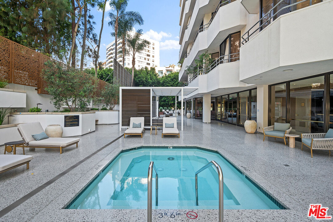 10601 Wilshire Boulevard, Unit 1201 Los Angeles, CA 90024 - Photo 41 of 48 a view of a patio with couches table and chairs