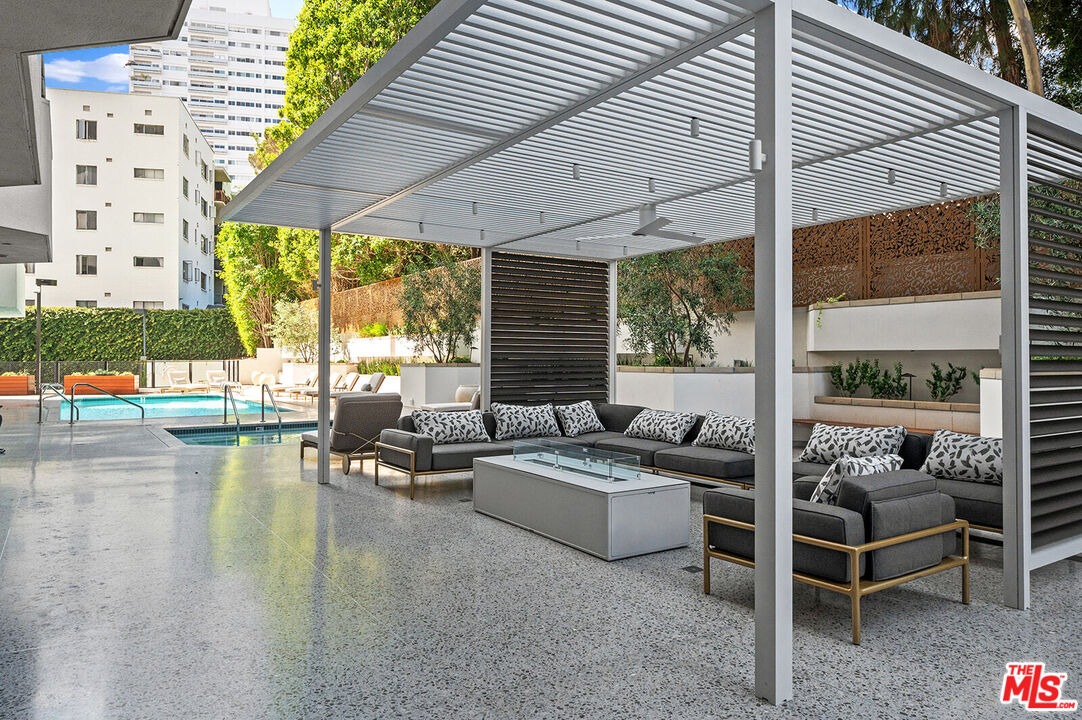 10601 Wilshire Boulevard, Unit 1201 Los Angeles, CA 90024 - Photo 42 of 48 a patio with patio a couch and chairs