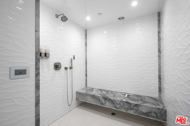 a bathroom with a shower and a tub