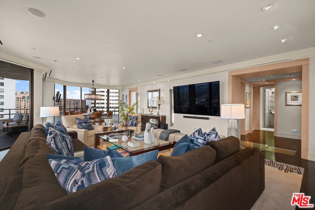 10601 Wilshire Boulevard, Unit 1201 Los Angeles, CA 90024 - Photo 6 of 48 a living room with furniture and a flat screen tv