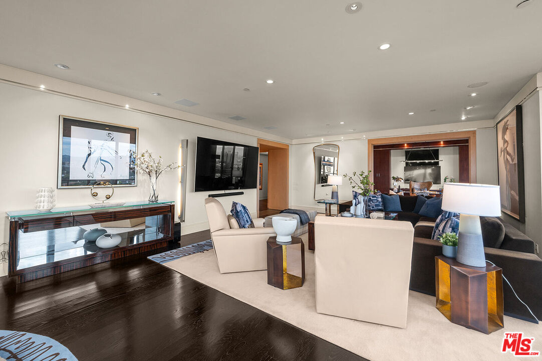 10601 Wilshire Boulevard, Unit 1201 Los Angeles, CA 90024 - Photo 8 of 48 a living room with furniture and a flat screen tv