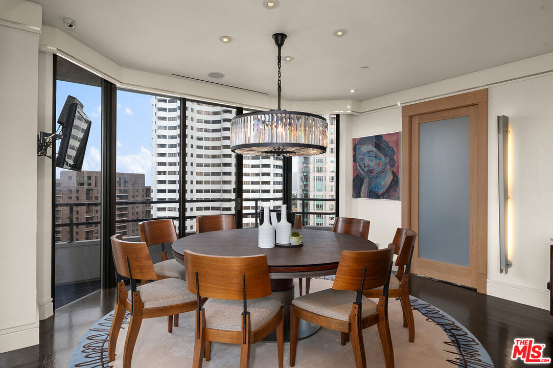 10601 Wilshire Boulevard, Unit 1201 Los Angeles, CA 90024 - Photo 10 of 48 a dining room with furniture window and wooden floor