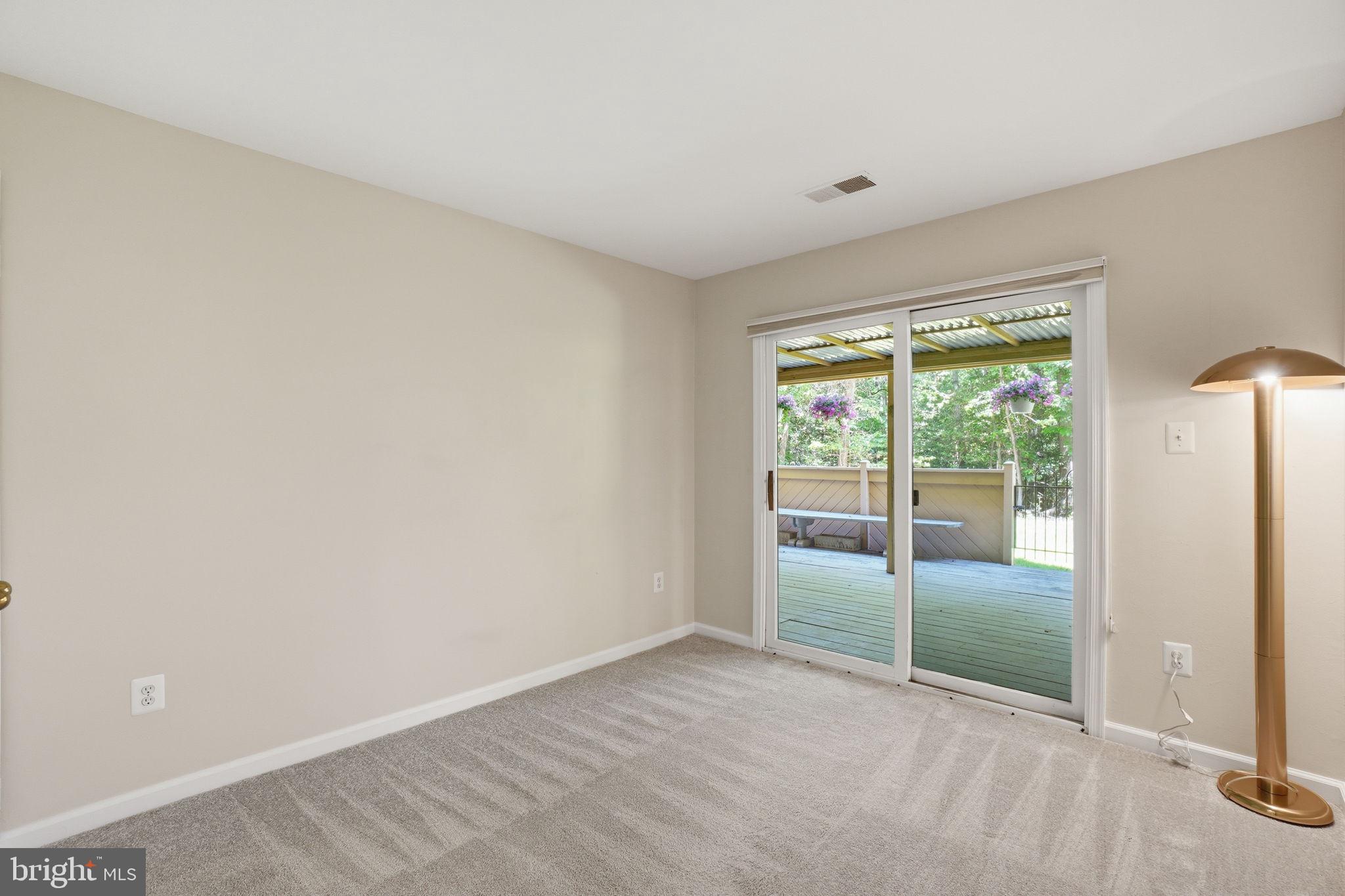 1495 Church Hill Place Reston, VA 20194 - Photo 10 of 27 an empty room with sliding glass door and shower