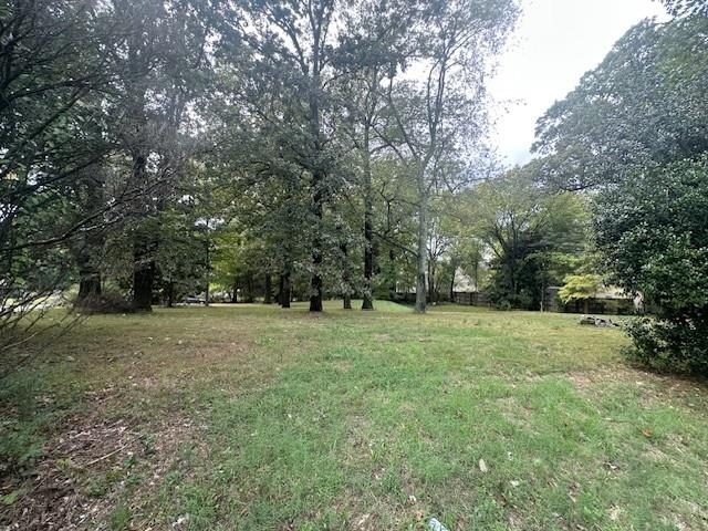 901 South Perkins Road Memphis, TN 38117 - Photo 8 of 10 a big yard with lots of green space and trees