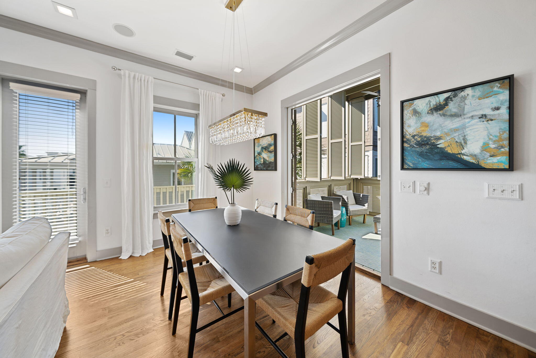 10140 East County Highway 30A, Unit 2 Inlet Beach, FL 32461 - Photo 29 of 92 a view of a dining room with furniture window and wooden floor