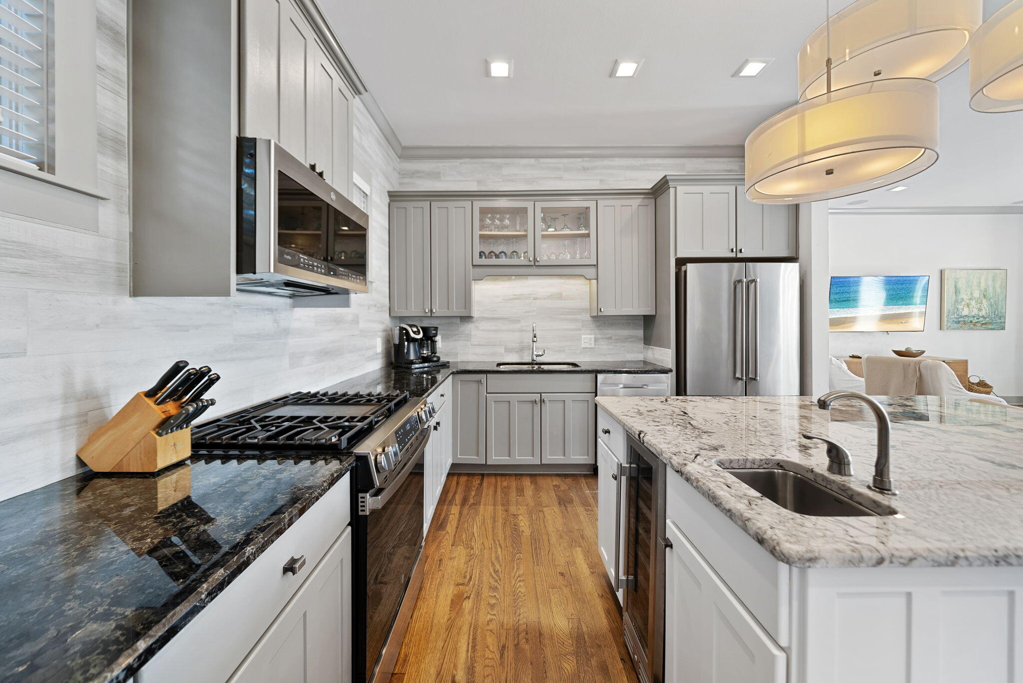 10140 East County Highway 30A, Unit 2 Inlet Beach, FL 32461 - Photo 40 of 92 a kitchen with stainless steel appliances granite countertop a sink stove and refrigerator