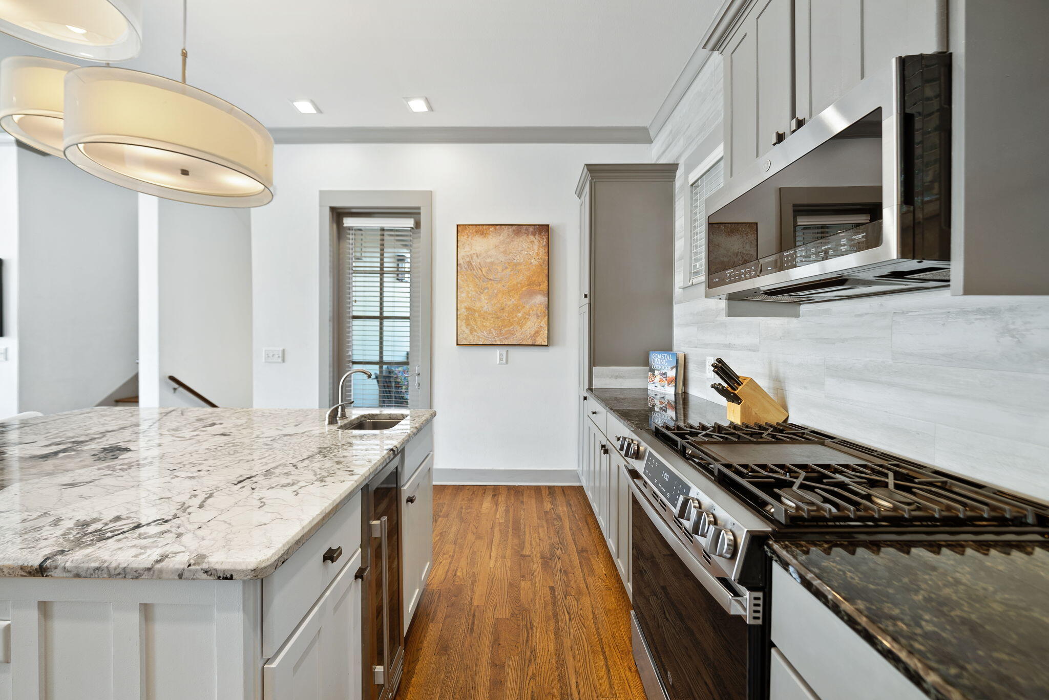10140 East County Highway 30A, Unit 2 Inlet Beach, FL 32461 - Photo 41 of 92 a kitchen with granite countertop stainless steel appliances and wooden cabinets
