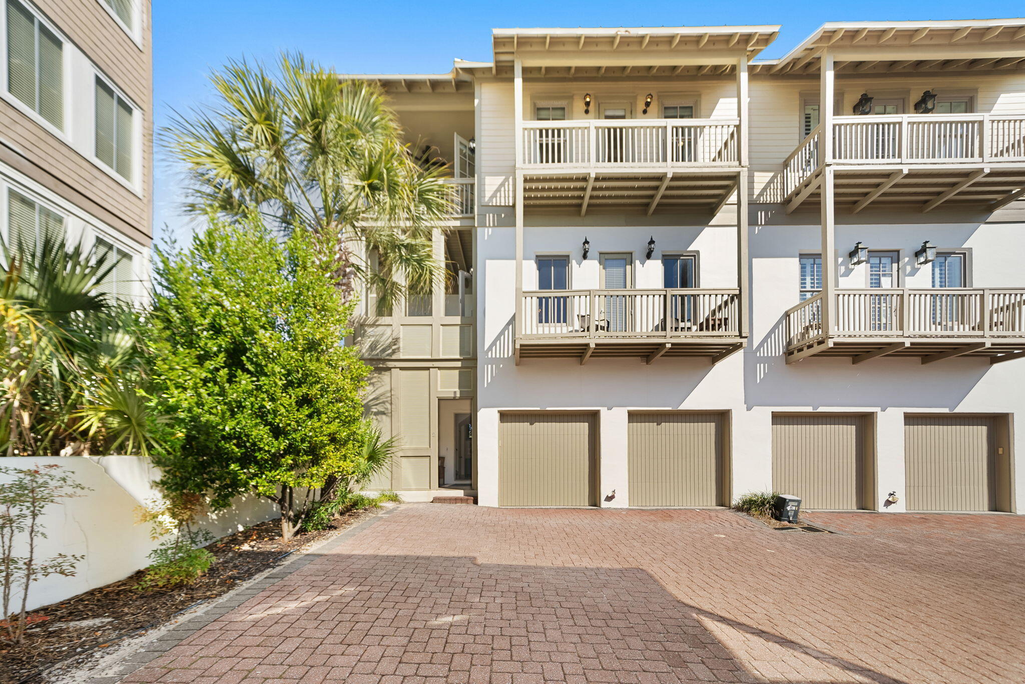 10140 East County Highway 30A, Unit 2 Inlet Beach, FL 32461 - Photo 59 of 92 a front view of a building with a garden